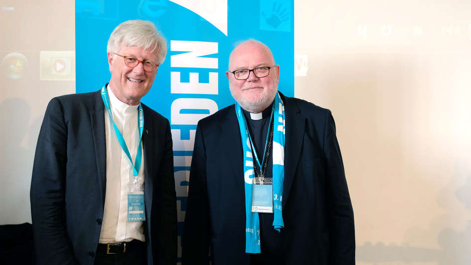 EKD-Ratsvorsitzender Heinrich Bedford-Strohm und Vorsitzender der katholischen Deutschen Bischofskonferenz Reinhard Marx auf dem Katholikentag 2018